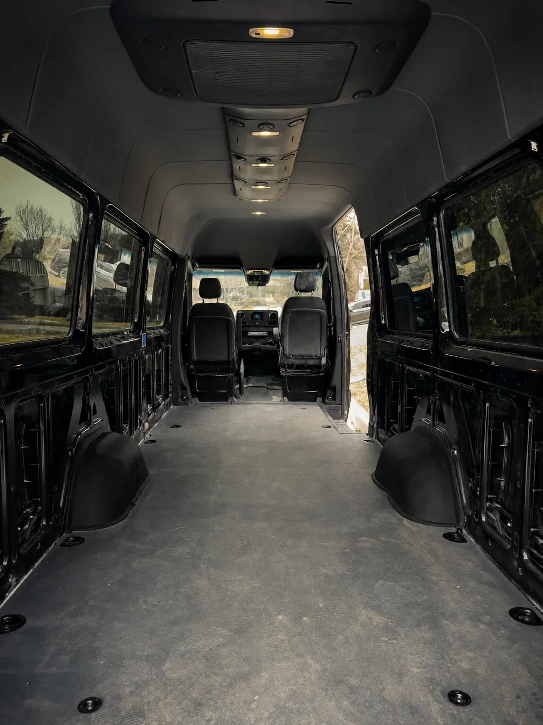Empty Luggage and Equipment Support Sprinter cargo area viewed toward the driver seats