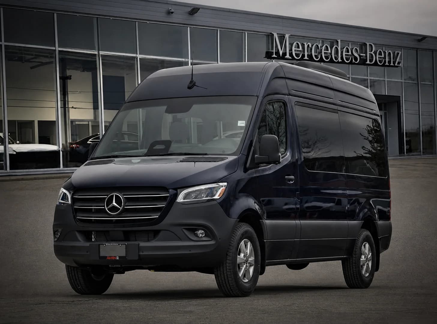 11-passenger Sprinter viewed from the front outside a Mercedes-Benz facility